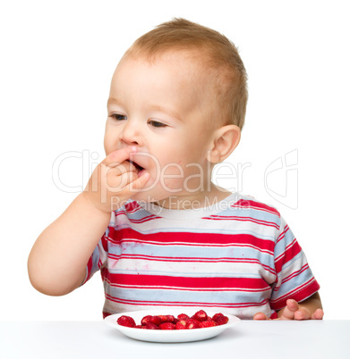 Cute little boy with strawberries