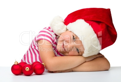 Cute little girl wearing santa hat