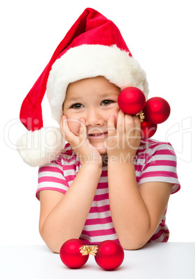 Cute little girl wearing santa hat