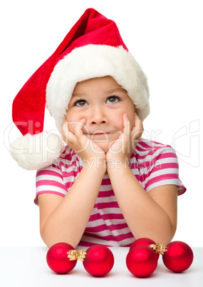 Cute little girl wearing santa hat