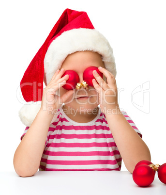 Cute little girl wearing santa hat