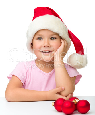Cute little girl wearing santa hat