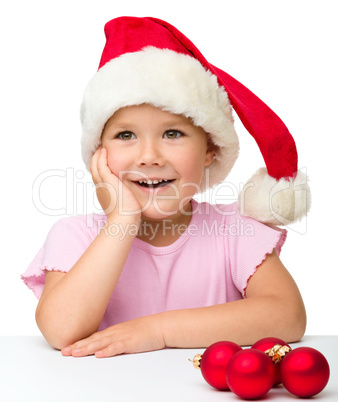 Cute little girl wearing santa hat