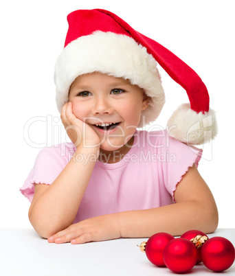 Cute little girl wearing santa hat