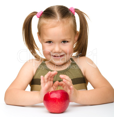 Little girl with red apple
