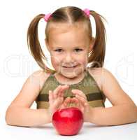 Little girl with red apple