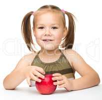 Little girl with red apple