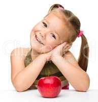 Little girl with red apple