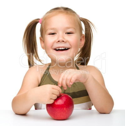 Little girl with red apple