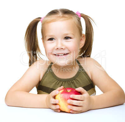 Little girl with red apple