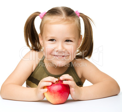 Little girl with red apple