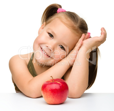 Little girl with red apple