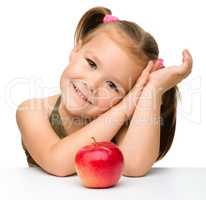 Little girl with red apple