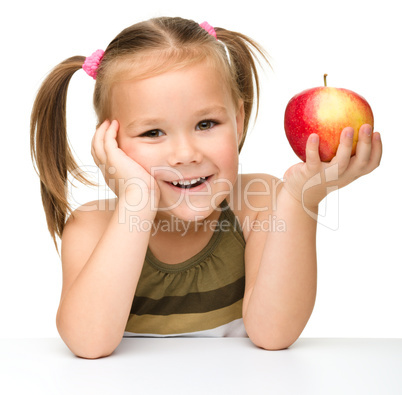 Little girl with red apple