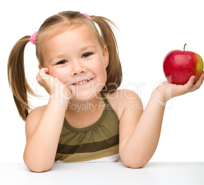 Little girl with red apple