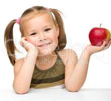 Little girl with red apple