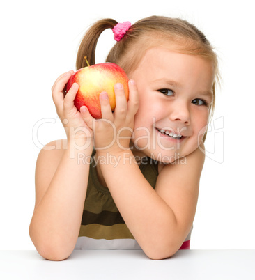 Little girl with red apple