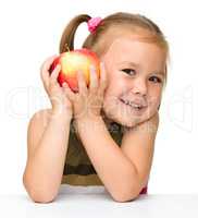 Little girl with red apple