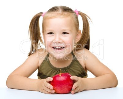 Little girl with red apple