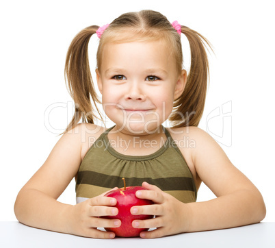 Little girl with red apple