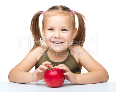 Little girl with red apple