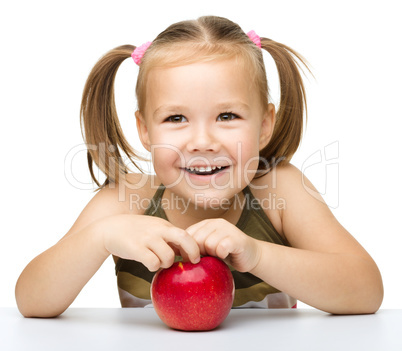 Little girl with red apple