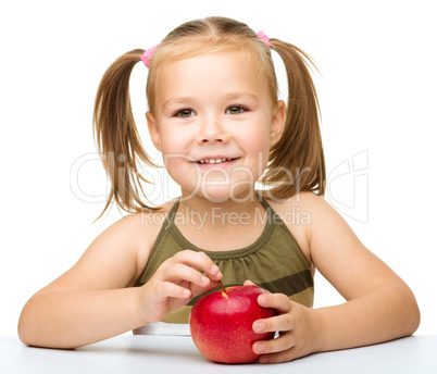 Little girl with red apple