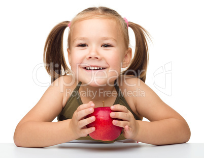 Little girl with red apple