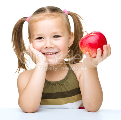 Little girl with red apple