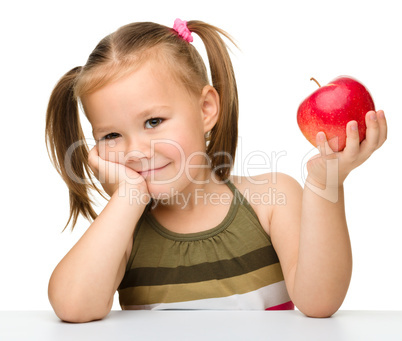 Little girl with red apple