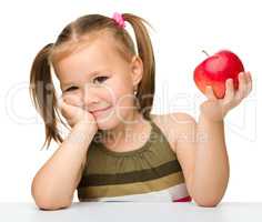 Little girl with red apple