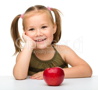 Little girl with red apple