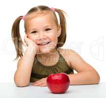 Little girl with red apple