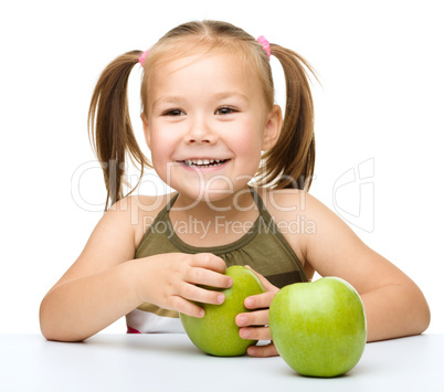 Little girl with red apple