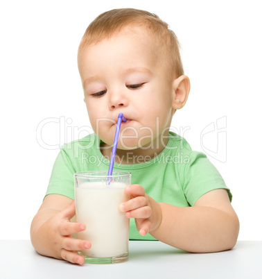 Cute little boy is drinking milk