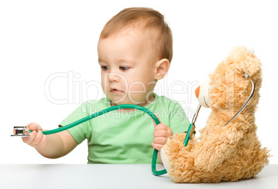 Little boy is playing doctor with stethoscope