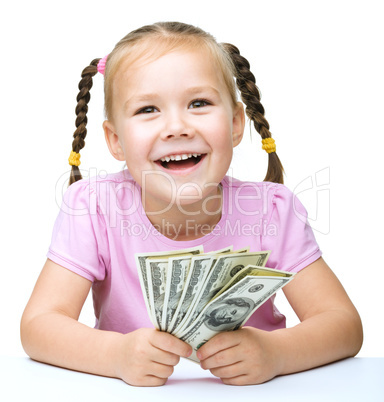 Little girl with dollars