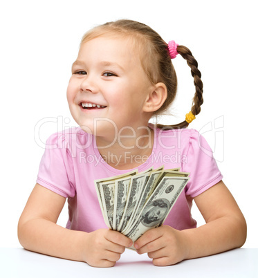 Little girl with dollars