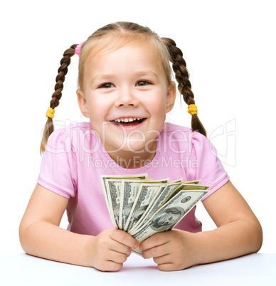 Little girl with dollars