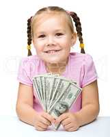 Little girl with dollars