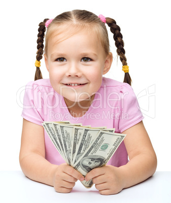 Little girl with dollars