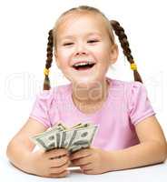 Little girl with dollars
