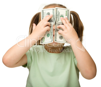 Cute little girl with paper money - dollars