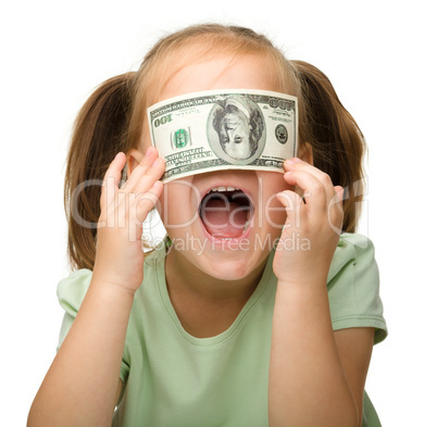 Cute little girl with paper money - dollars