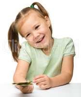 Cute little girl with paper money - dollars