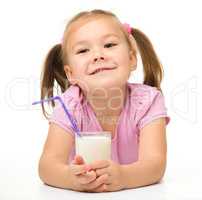 Little girl with a glass of milk