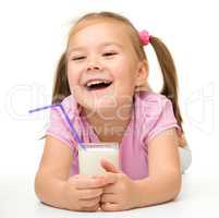 Little girl with a glass of milk