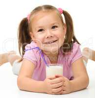 Cute little girl with a glass of milk