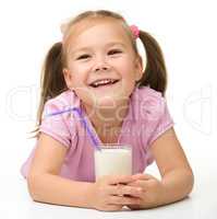 Little girl with a glass of milk