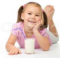 Little girl with a glass of milk